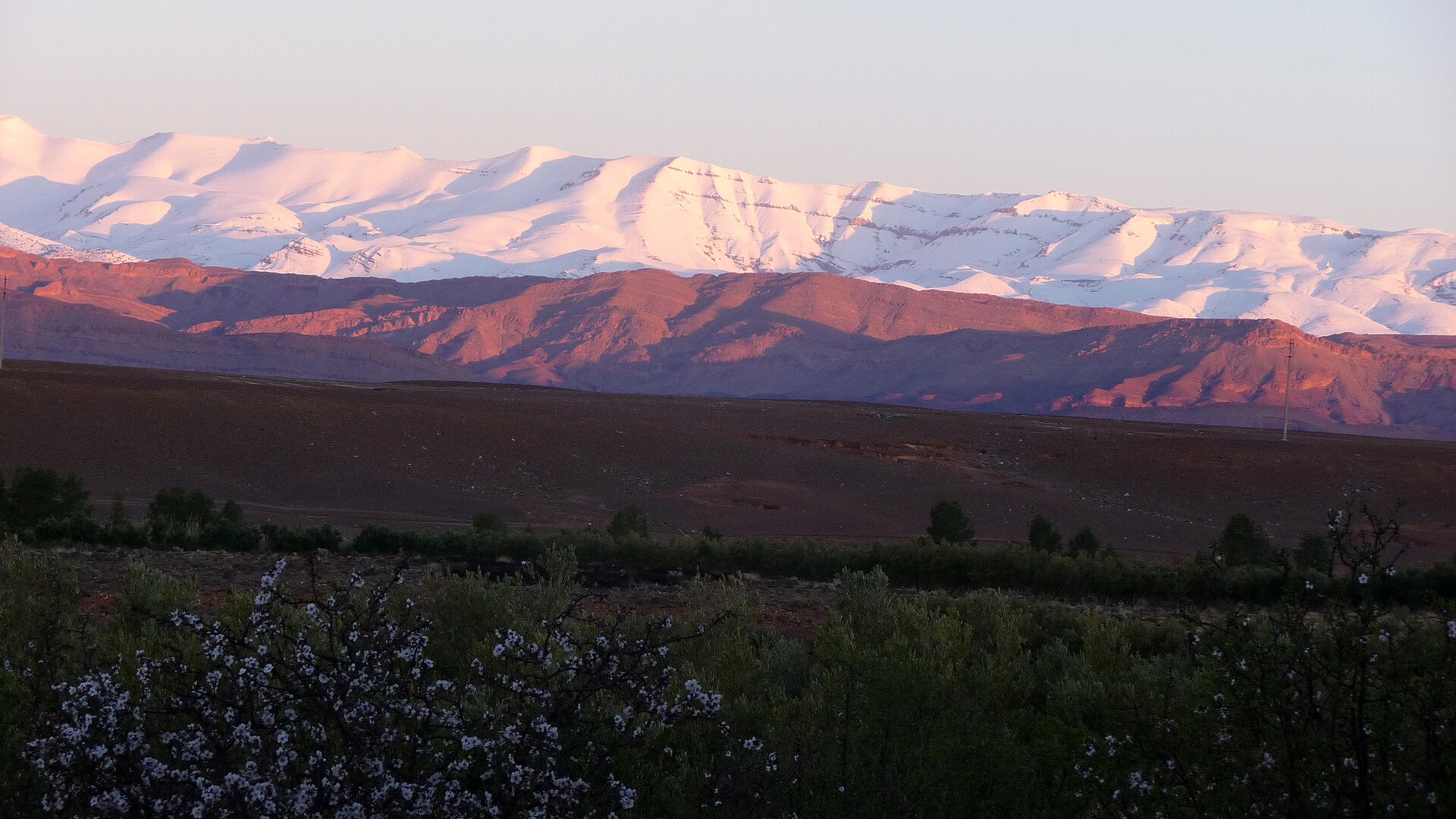 Sunrise turning the snow of the High Atlas pink above the Dades Valley